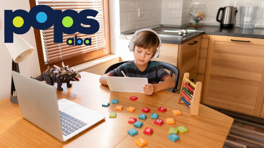 A young boy focuses on his notes at a table with puzzle pieces and an open laptop, following his autism routine schedule.