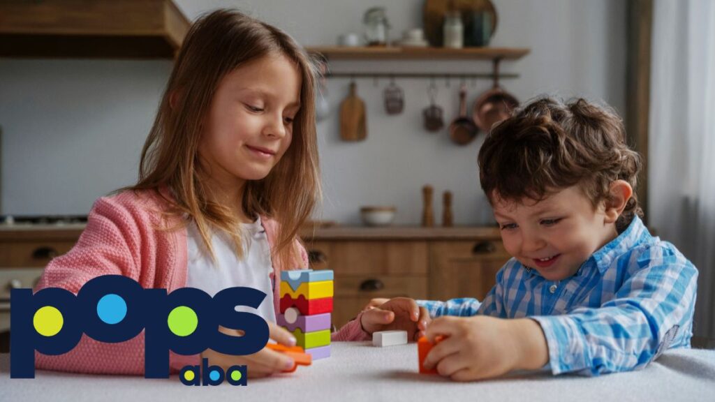 A therapist guides a young boy during a session, using plastic toy pieces while observing his behavior, showing contrast between ASD vs OCD.